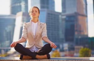 woman-meditating-in-city-meet-your-anti-ageing-and-anti-stress-hormones-by-Healthista.com