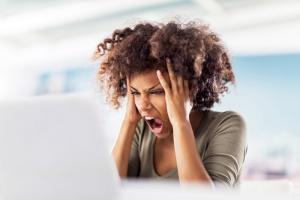 Angry woman using computer, 5 ways to stop being angry, by healthista