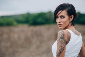 Woman with tattoo on her shoulder and arm, are you ever too old to get a tattoo, by healthista