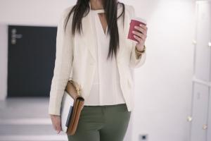 woman walking into work, 7 ways to get rid of back pain, by healthista