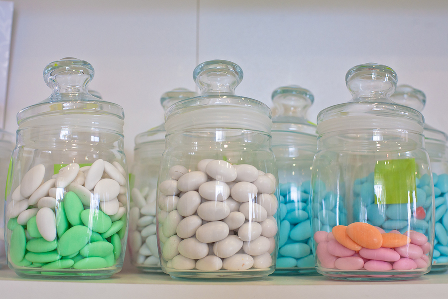 glass jar with colored pills