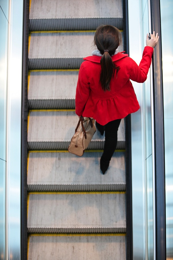 woman escalator