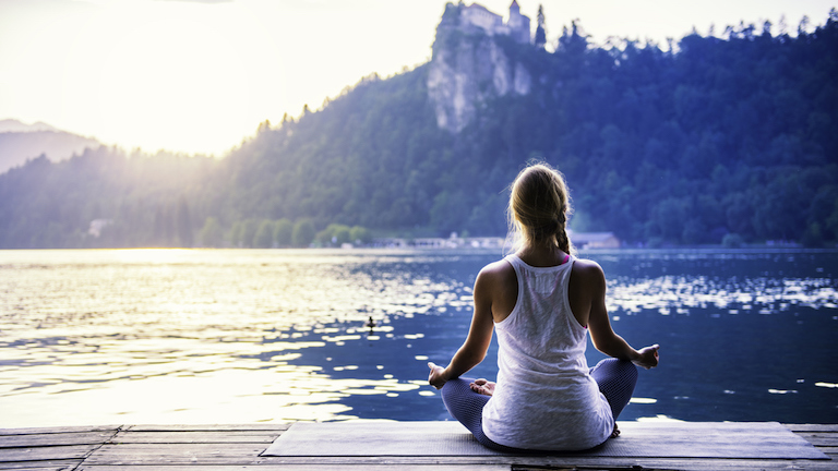 woman-meditating-best-meditation-retreats-uk-by-healtista.com-main-image