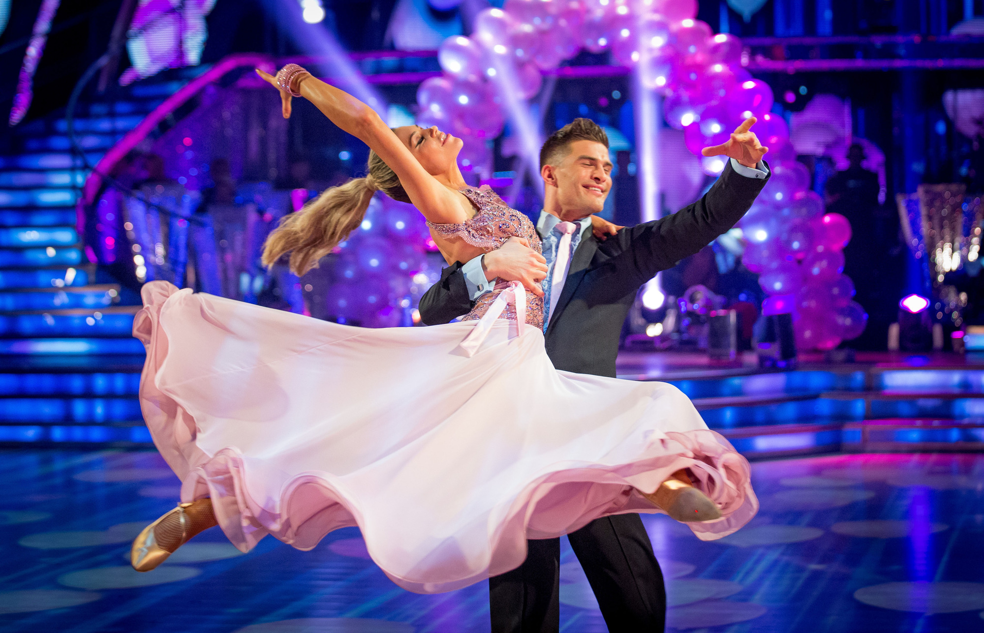 Eyes closed, Abbey and Aljaz are both caught in the moment of their American Smooth