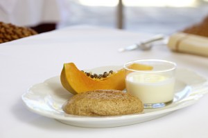 Breakfast: papaya, goat's yoghurt and spelt bread