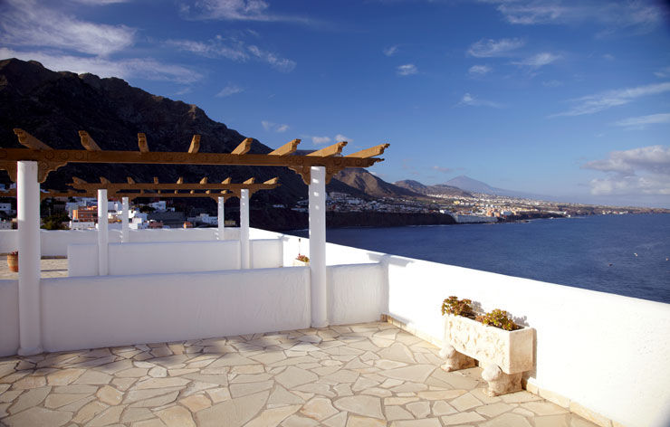 The hotel is flanked by mountains on one side and sea on the other