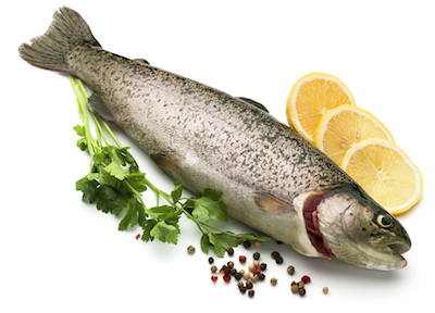 Raw fish with lemon and parsley isolated on white background