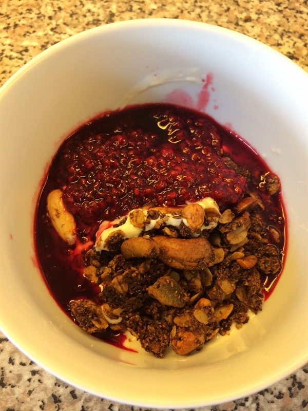 Soya, homemade granola and raspberries. 