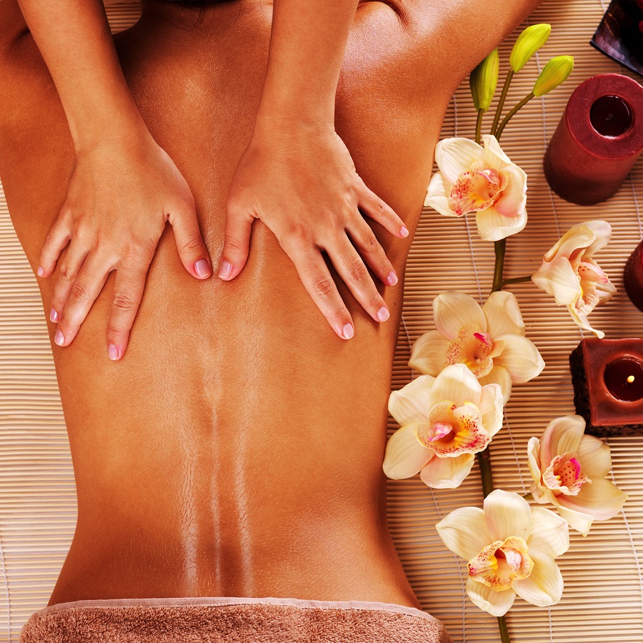 Masseur doing massage on woman back in the spa salon