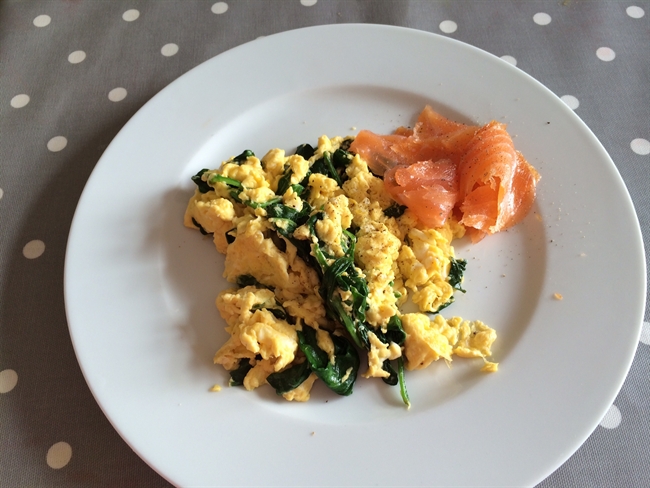 Scrambled eggs with spinach and smoked salmon.