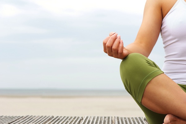 Portrait Of Female Yoga Hands At The Beach