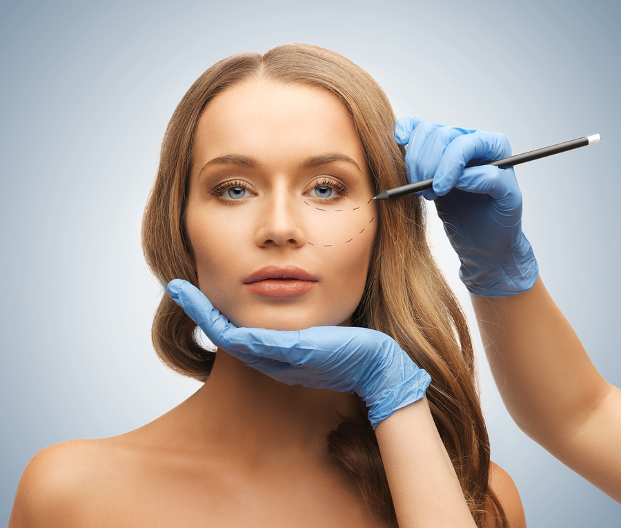 picture of woman face and beautician hands with pencil