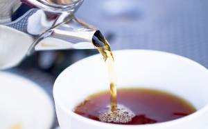 Pouring Hot Tea From Restaurant Style Cattle