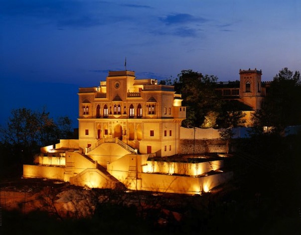 The exterior of the Ananda resort at night