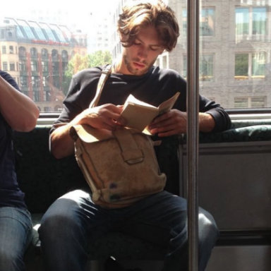 Hot dude reading on train, We love: Hot Dudes Reading, by Healthista.com