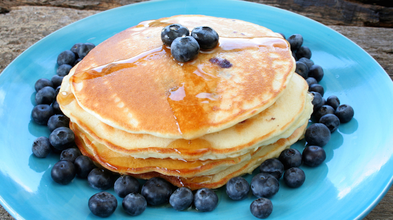 Pancakes topped with blueberries, Healthy pancake recipe from Davina McCall - just in time for a guilt-free treat tonight, by Healthista.com