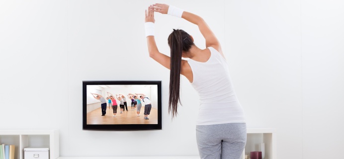 Woman stretching infront of TV, Belly Blasting Walk DVD Review by Healthista.com