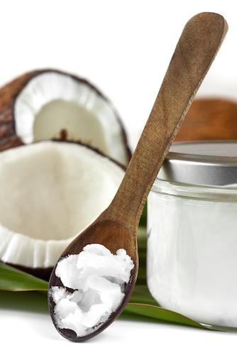 coconut oil on wooden spoon, What's in Madeleine Shaw's fit kit?, by Healthista.com