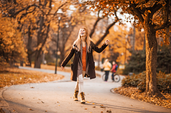 woman walking in the park, How to beat low energy levels and avoid the afternoon slump, by Healthista.com