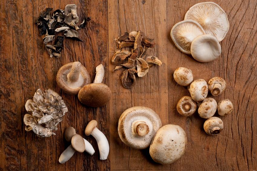 mushrooms on carving board, grocery list to help fight fatigue by healthista.com