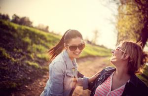 women-laughing-outside-meet-your-anti-stress-and-anti-ageing-hormones-by-Healthista.com