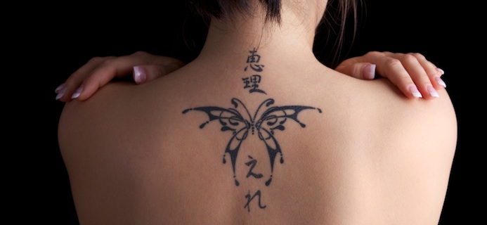 woman with back tattoo, things to know about tattoo laser removal, by healthista.com