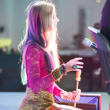 woman giving a talk, london wellbeing festival, by healthista