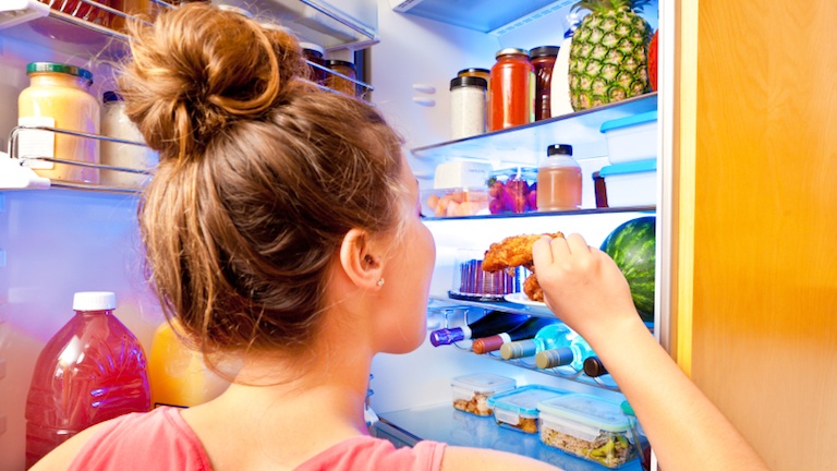 woman eating from fridge, 11 reasons you're always hungry, by healthista