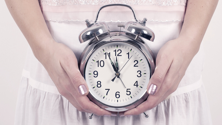 woman-holding-clock-how-to-make-your-body-clock-work-for-you-by-healthista.