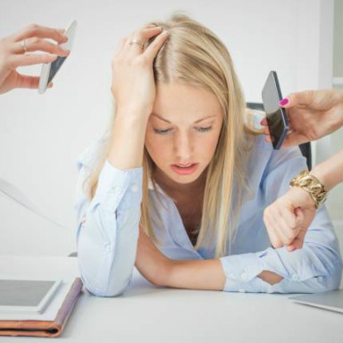 woman-surrounded-by-phones-breast-cancer-by-healthista