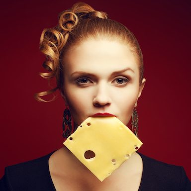 woman-ith-slice-of-cheese-in-mouth-how-you-really-feel-on-diets-by-healthista.com