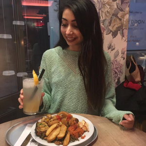 Parisa smiling at drink, Eating out as a vegan - 4 week no meat, egg or dairy challenge by healthista