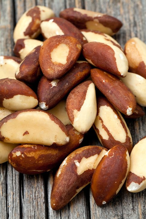 brazil nuts on wooden surface