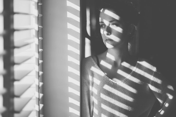 Sad woman looking through the window, 8 signs that you are having a breakdown, by healthista.com (feature)