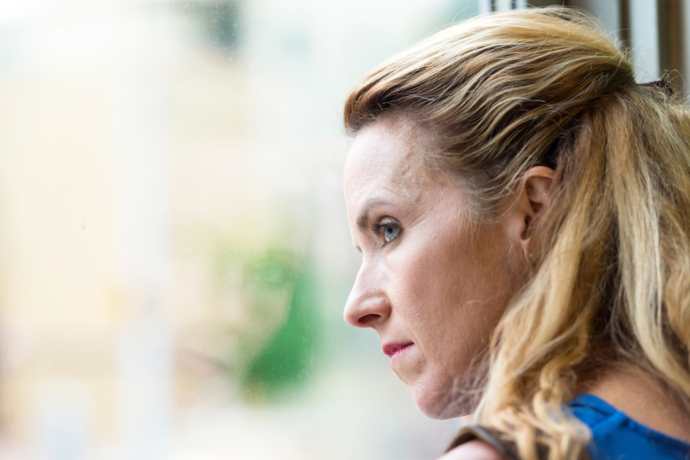 woman-looking-out-window-The-Menopause-----what-every-woman-needs-to-know-Healthista