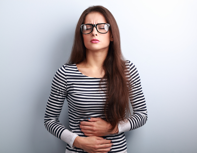 woman sore tummy, symptoms of coeliac disease to never ignore by healthista