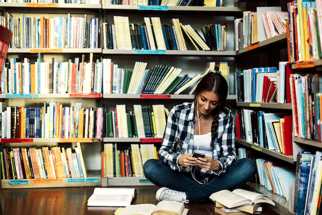 student-in-library-listening-to-ipod-music-therapy-by-healthista.com-body-image4.jpg