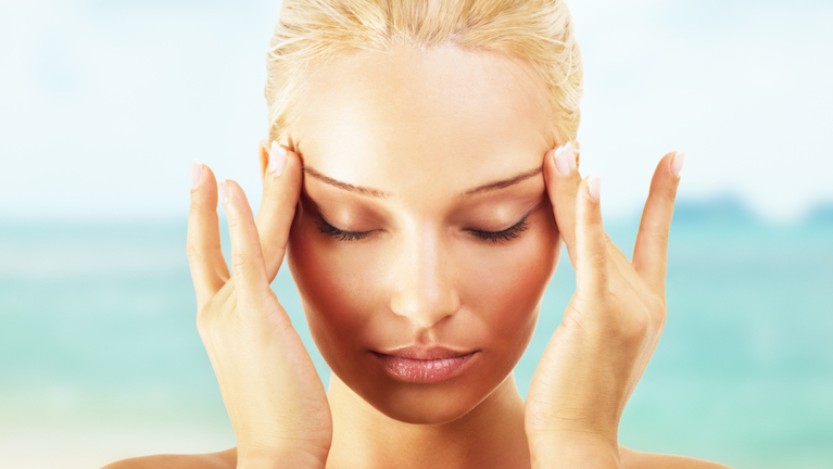 woman-massaging-face-how-to-get-rid-of-puffy-eyes-by-healthista.com-main