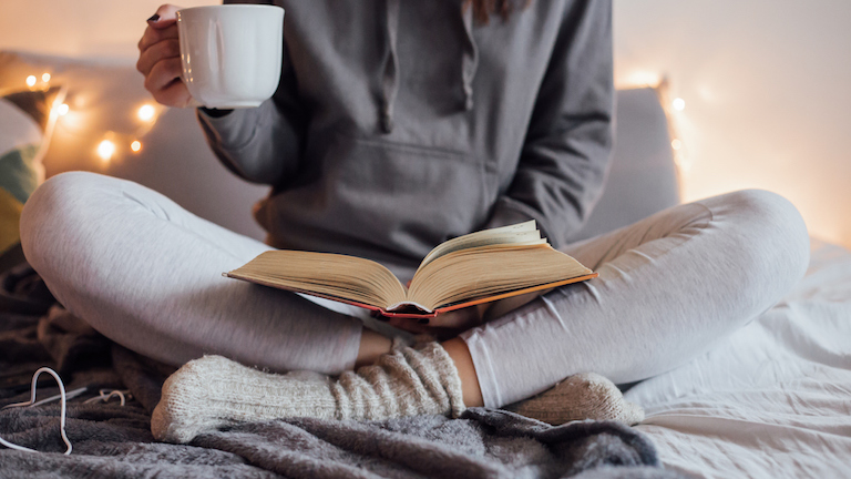 girl-reading-on-bed-novels-that-changed-your-life-healthista-main-image.jpg