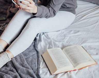 girl-with-book-on-bed-novels-that-changed-your-life-healthista-featured-image.jpg