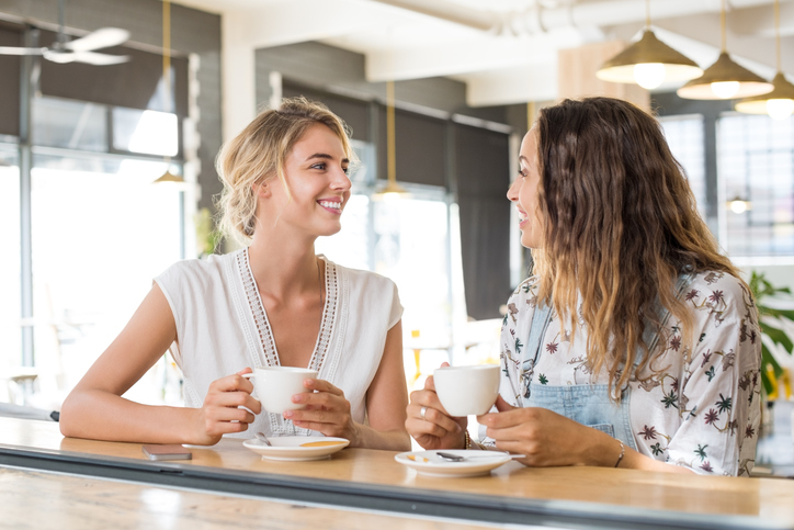 women chatting over coffee, how to make friends by healthista