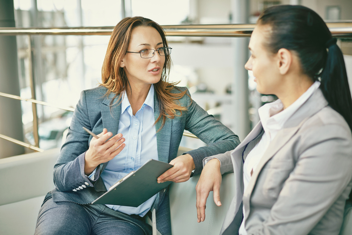 female office workers chatting, 8 questions smart women want to know about negotiating a pay rise by healthista