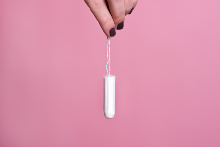 Woman's hand holding a clean cotton tampon Is less more when it comes to exercise? 5 signs of overtraining by healthista.com