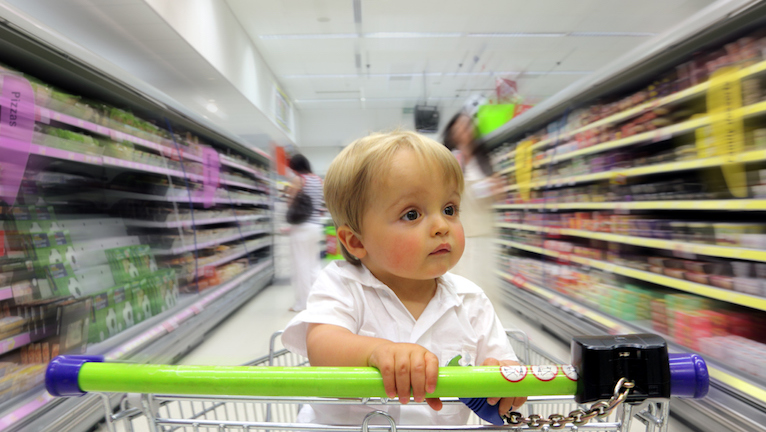 little-boy-in-trolley-how-supermarkets-make-you-spend-money-healthista