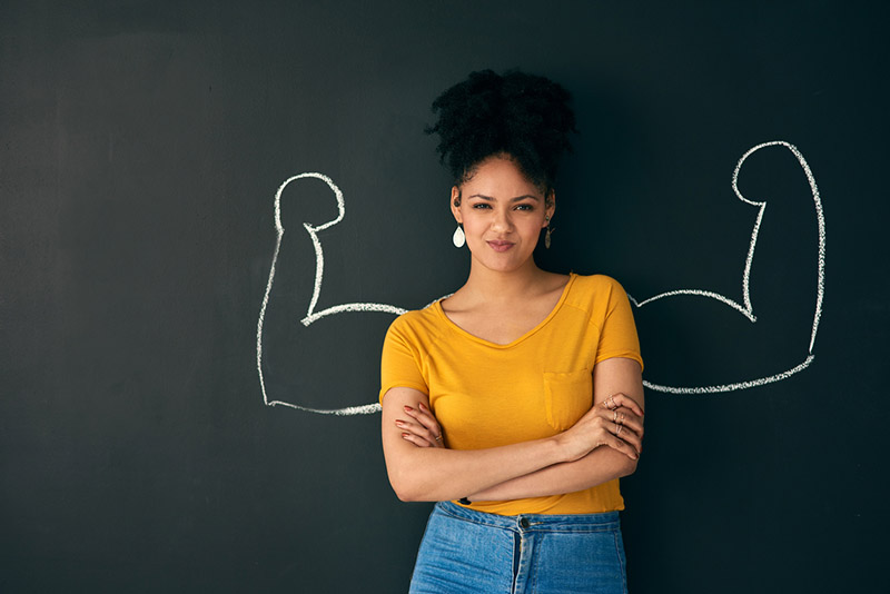  girl-standing-infront-chalkboard-with-arms-crossed-11-signs-youre-addicted-and-how-to-overcome-them-by-healthista