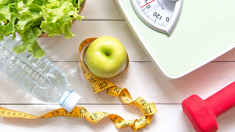 scale-dumbell-apple-water-bottle-and-lettuce-12-best-weight-loss-tips-this-nutritionist-has-heard-healthista