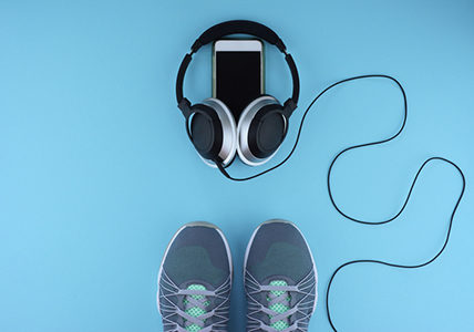 blue-mat-with-workout-shoes-phone-and-headphones-20-rock-songs-thatll-pump-up-your-exercise-routine-healthista