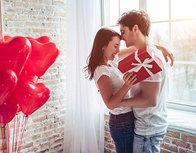 couple-embracing-with-girl-holding-red-gift-8-challenges-long-distance-relationships-face-and-how-to-overcome-them-from-Milena-Nguyen-healthista