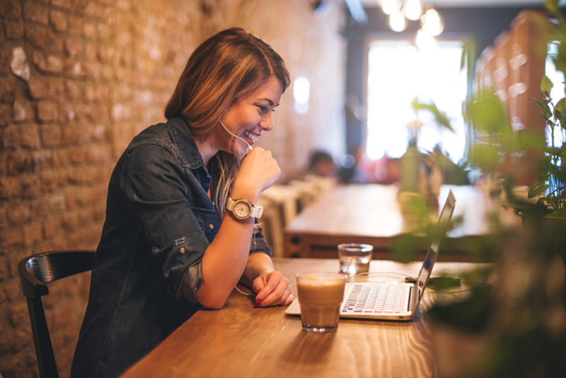 woman-smiling-at-computer-while-on-video-call-8-challenges-long-distance-relationships-face-and-how-to-overcome-them-from-milena-nguyen-healthista