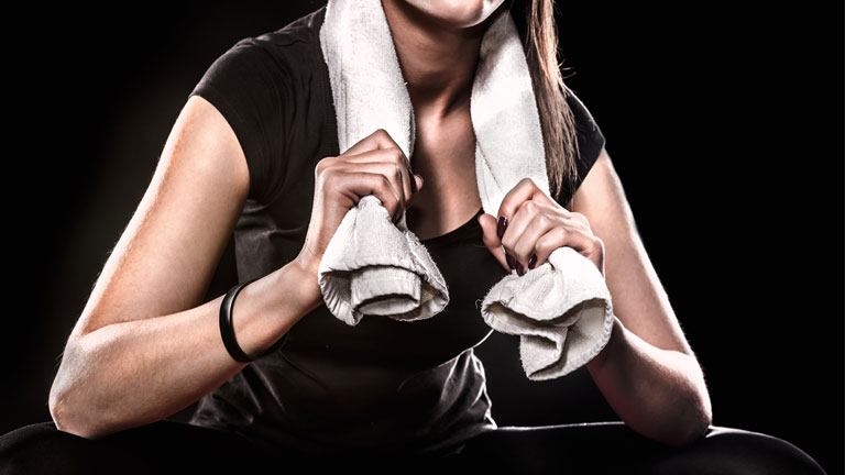 woman-with-towel-around-her-neck,--30-Day-dumbbell-workout-challenge---Day-22-by-healthista.com